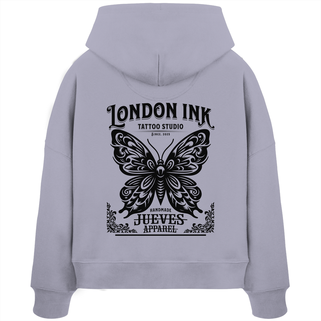 Rückansicht eines lavendel Damen Oversized Boxcut Hoodies von Jueves Apparel aus 100 % Baumwolle, 300 g/m² – markanter Rückendruck und urbaner Streetwear-Look mit modernem Schnitt. 